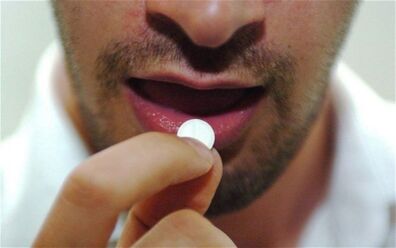 a man takes a stimulant pill
